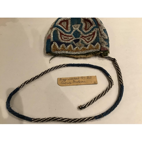 99 - A 19th century Native North American, Iroquois horseshoe shaped multi-coloured beaded purse with cen... 