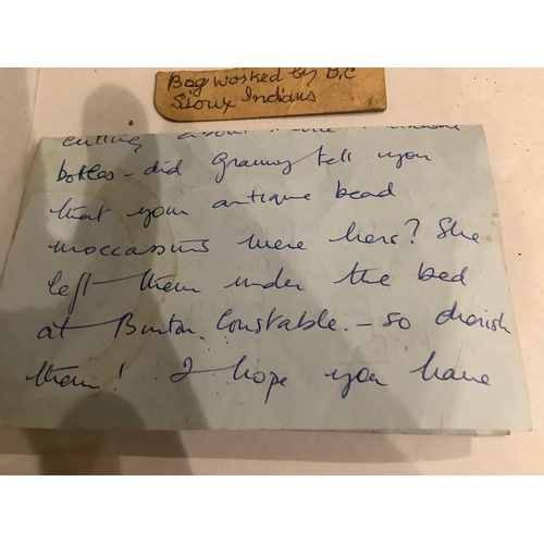 99 - A 19th century Native North American, Iroquois horseshoe shaped multi-coloured beaded purse with cen... 