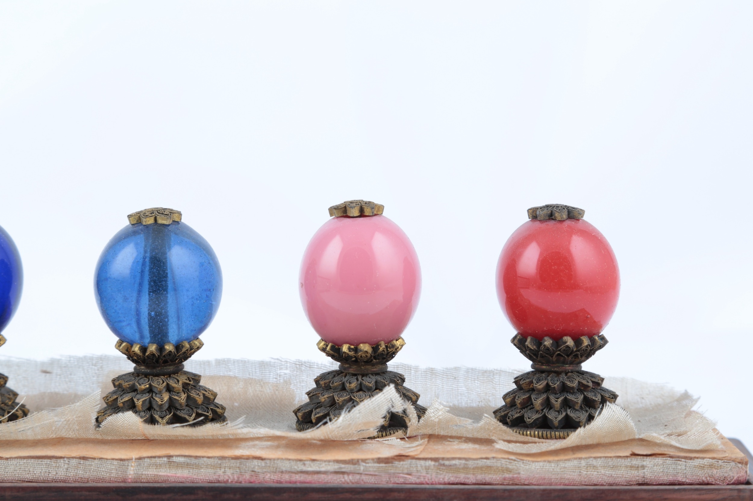 A cased set of seven Chinese Mandarin civil official hat finials, late ...