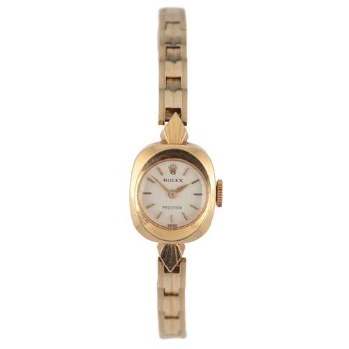127 - A lady's 18k gold Rolex Precision manual wind wrist watch, on an associated 14k gold bracelet, with ... 