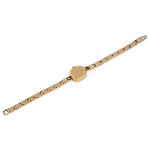 127 - A lady's 18k gold Rolex Precision manual wind wrist watch, on an associated 14k gold bracelet, with ... 