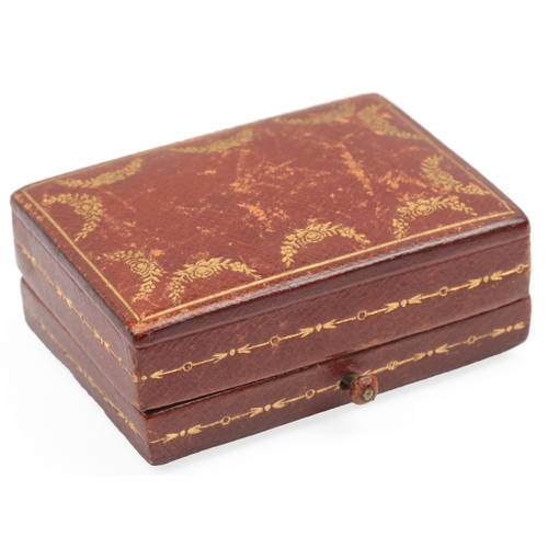 136 - Cartier New York, a gilt tooled leather box, early 20th century, in tooled brown leather, lined in c... 