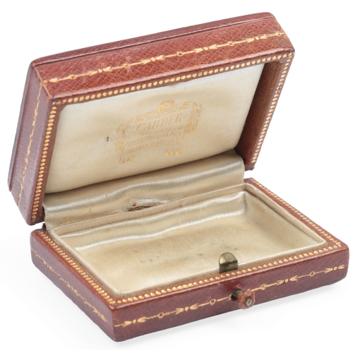 136 - Cartier New York, a gilt tooled leather box, early 20th century, in tooled brown leather, lined in c... 