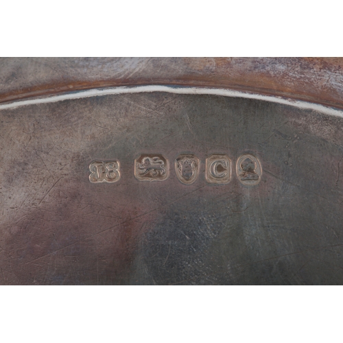 22 - A George III silver oval teapot stand by John Eames, with engraved decoration, reeded border, on fou... 