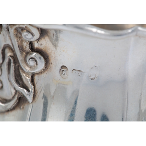 38 - A George IV Irish silver cream jug, Dublin, 1825, of lobed baluster form, with engraved crest, indis... 