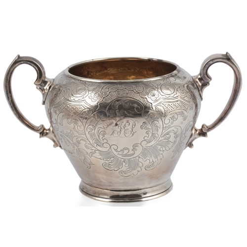 50 - A Victorian engraved silver three piece tea set, by Walter Morrisse, of pyriform and inverted pyrifo... 