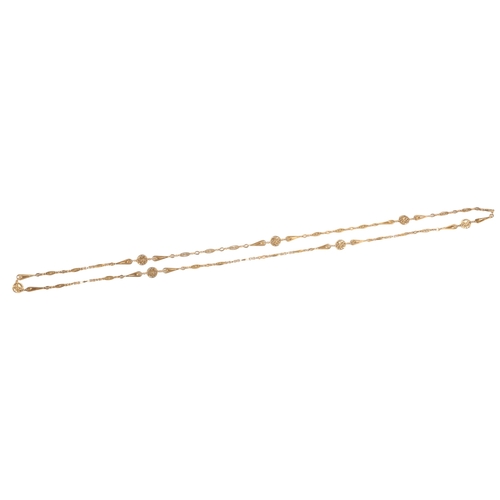 590 - An attractive gold longchain, early 20th century, composed of floral medallion, pear-shaped and oval... 