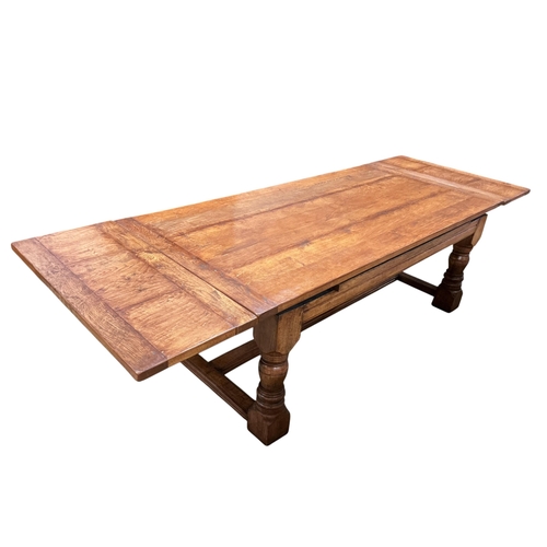 2061 - An 18th style rectangular oak draw leaf refectory dining table by John Capon of Norwich with cleated... 