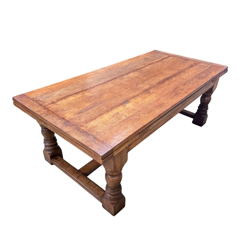 2061 - An 18th style rectangular oak draw leaf refectory dining table by John Capon of Norwich with cleated... 