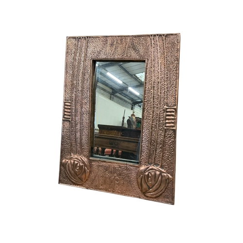 2070 - A Glasgow school style hammered copper mirror, late 20th century, inscribed 1904 and The Willow. wid... 
