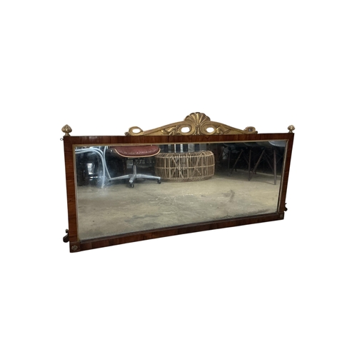 2073 - A Regency style rosewood and parcel gilt overmantel mirror, width 137cm, height 67cm