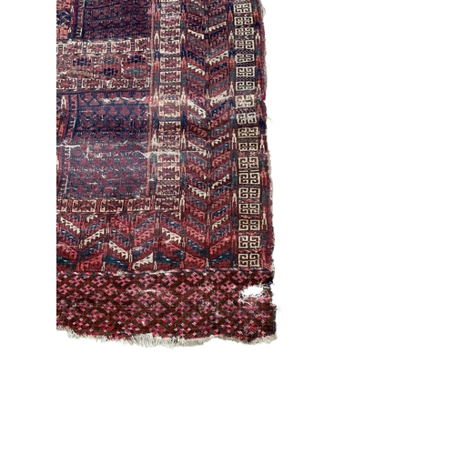 2079 - An antique Tekke rug fragment, 144 x 123cm and a machined Caucasian style panel, 253 x 138cm