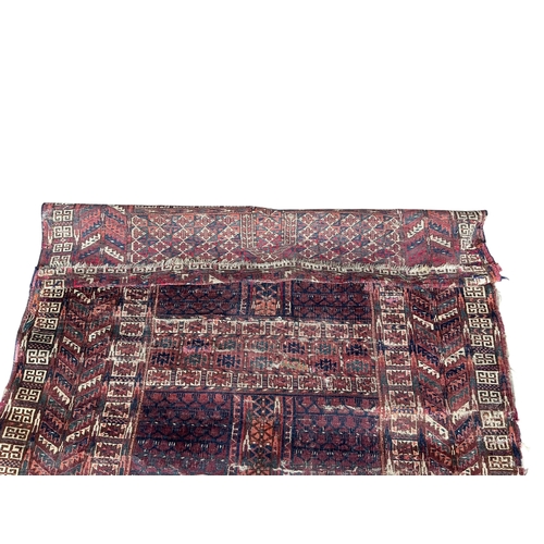 2079 - An antique Tekke rug fragment, 144 x 123cm and a machined Caucasian style panel, 253 x 138cm