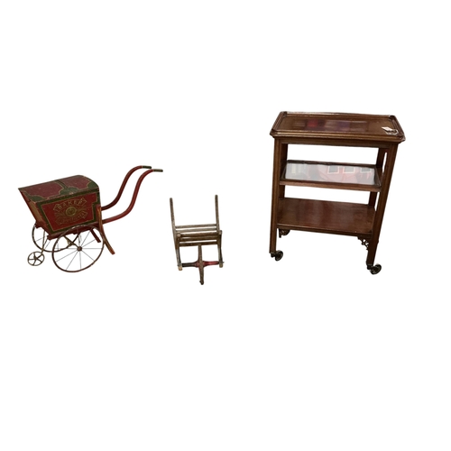 2086 - A tea trolley with removable tray top, width 44cm, depth 66cm, height 85cm and two children's toys... 