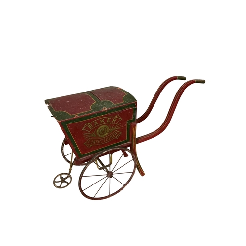 2086 - A tea trolley with removable tray top, width 44cm, depth 66cm, height 85cm and two children's toys... 