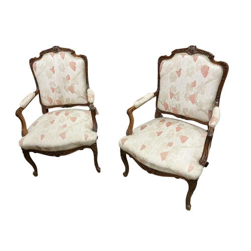 2089 - A pair of early 20th century walnut fauteuils, width 67cm, depth 55cm, height 102cm