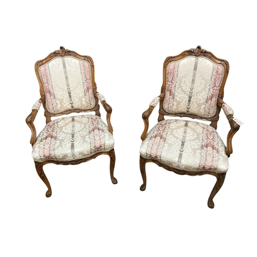 2090 - A pair of early 20th century French walnut fauteuils, width 65cm, depth 50cm, height 103cm