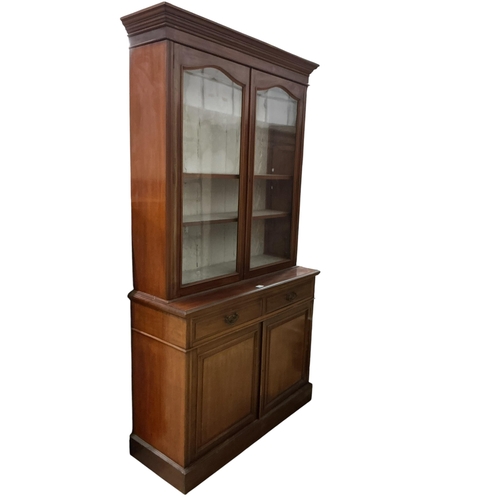 2099 - A late Victorian mahogany bookcase cupboard, width 123cm, depth 45cm, height 226cm