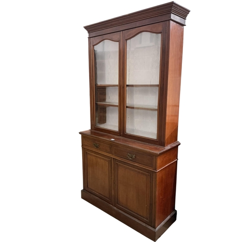 2099 - A late Victorian mahogany bookcase cupboard, width 123cm, depth 45cm, height 226cm