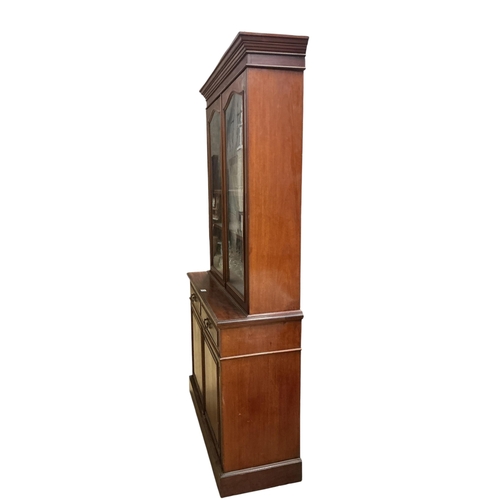 2099 - A late Victorian mahogany bookcase cupboard, width 123cm, depth 45cm, height 226cm