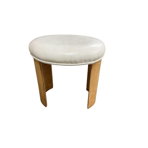 2102 - A British Art Deco oval stool, the upholstered padded seat raised on twin curved supports, c.1930, w... 