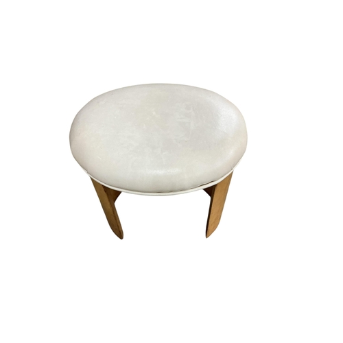 2102 - A British Art Deco oval stool, the upholstered padded seat raised on twin curved supports, c.1930, w... 