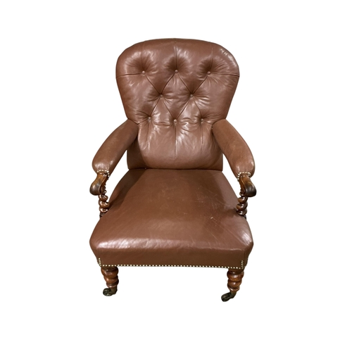 2103 - A Victorian walnut and leather upholstered library armchair with barley twist supports and legs, wid... 