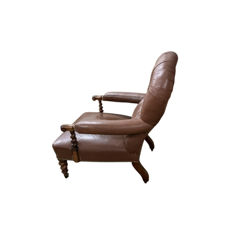 2103 - A Victorian walnut and leather upholstered library armchair with barley twist supports and legs, wid... 