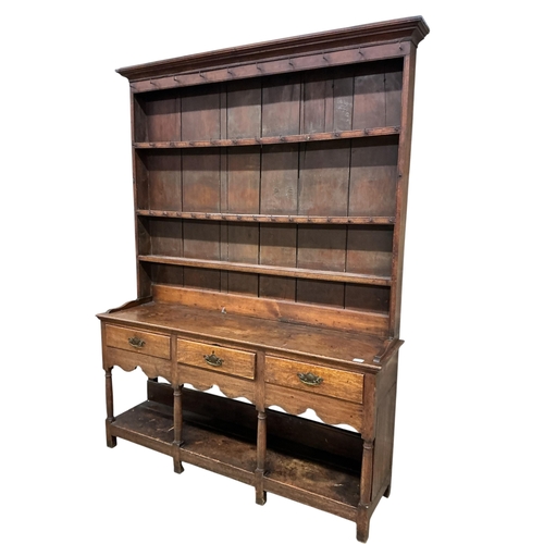 2109 - A George III oak potboard dresser with boarded rack, width 164cm, depth 43cm, height 220cm