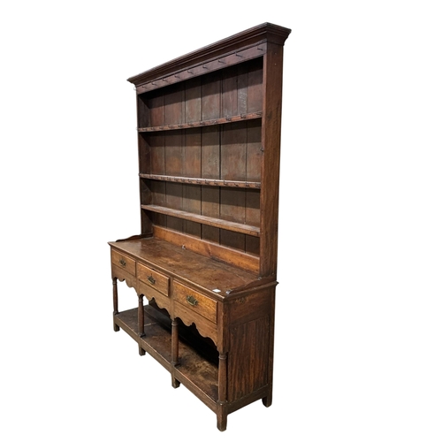 2109 - A George III oak potboard dresser with boarded rack, width 164cm, depth 43cm, height 220cm