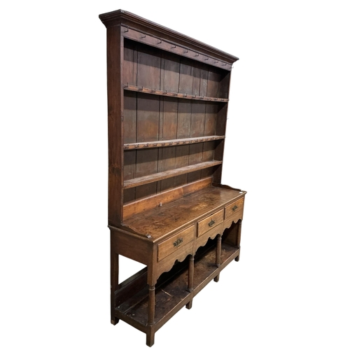 2109 - A George III oak potboard dresser with boarded rack, width 164cm, depth 43cm, height 220cm