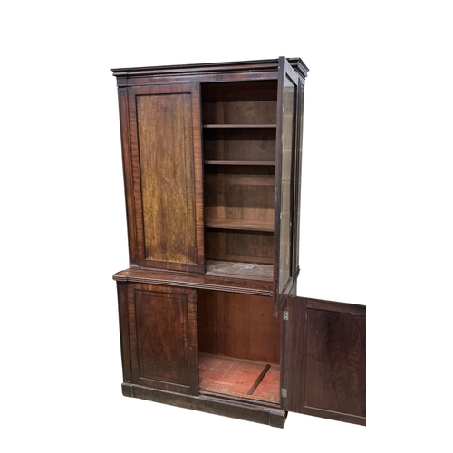 2110 - A Regency mahogany bookcase, in two sections, each enclosed by a pair of panelled doors, width 128cm... 