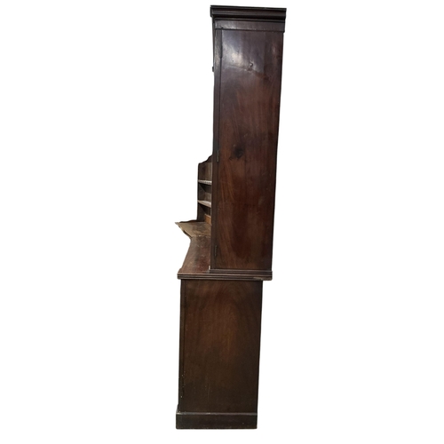 2110 - A Regency mahogany bookcase, in two sections, each enclosed by a pair of panelled doors, width 128cm... 