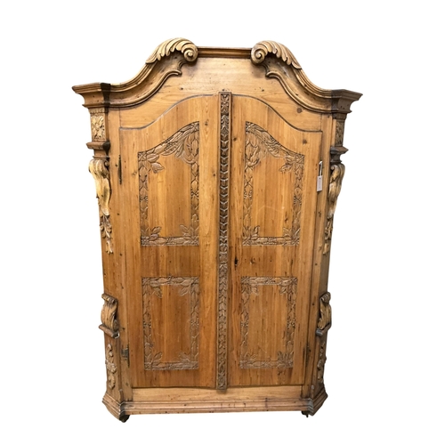 2119 - A 19th century Tyrolean style pine armoire, width 133cm, depth 54cm, height 191cm