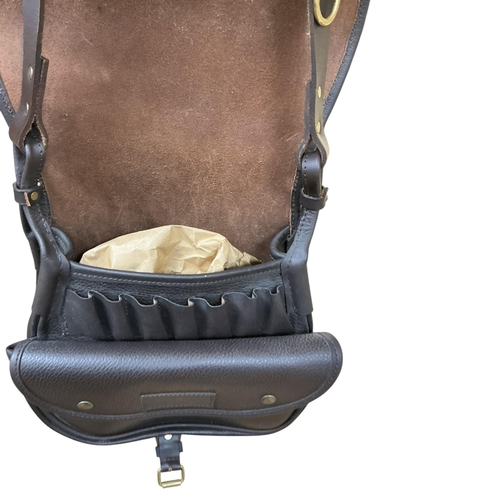 2273 - A Conway brown leather cartridge case with shoulder strap.