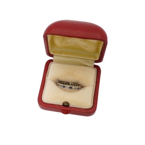 2989 - An unmarked white metal, sapphire and diamond set full eternity ring, size U, gross weight 4.6 grams... 