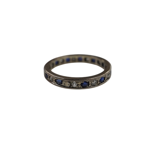 2989 - An unmarked white metal, sapphire and diamond set full eternity ring, size U, gross weight 4.6 grams... 