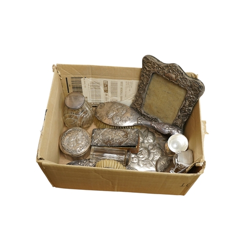 1841 - A group of assorted dressing table items including toilet jars, hand mirror and brushes, together wi... 