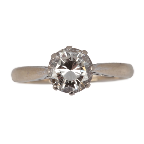 A diamond solitaire ring, circa 1980, claw-set with a brilliant-cut ...