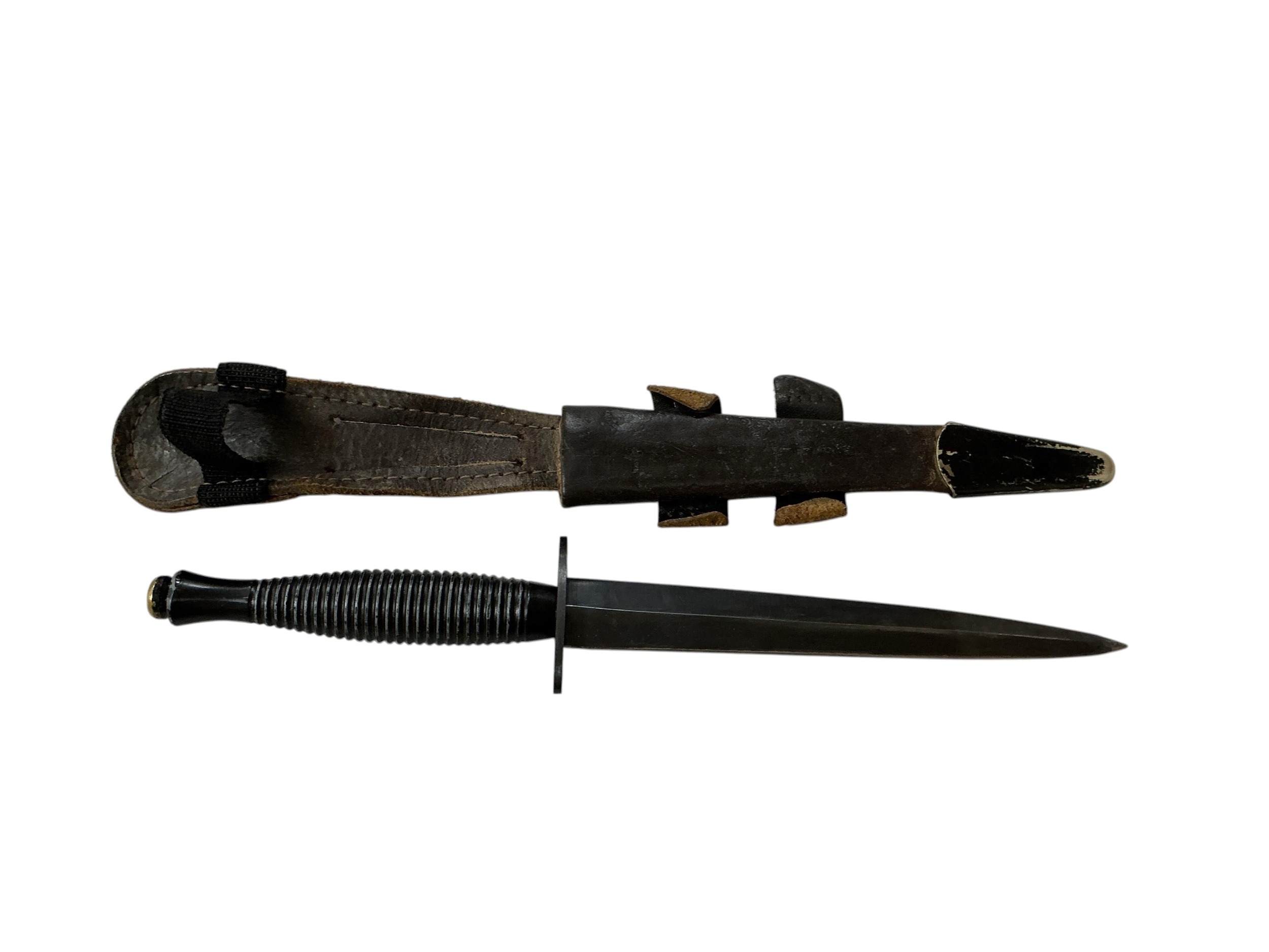 An FS fighting knife of conventional form, the cross piece stamped ...