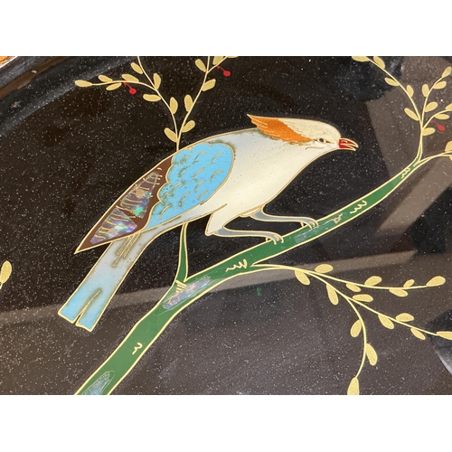 An abalone shell-inlaid oval panel depicting a bird among flowering ...
