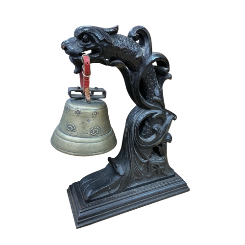 A Chinese carved hardwood and bronze dragon temple bell, height 40cm
