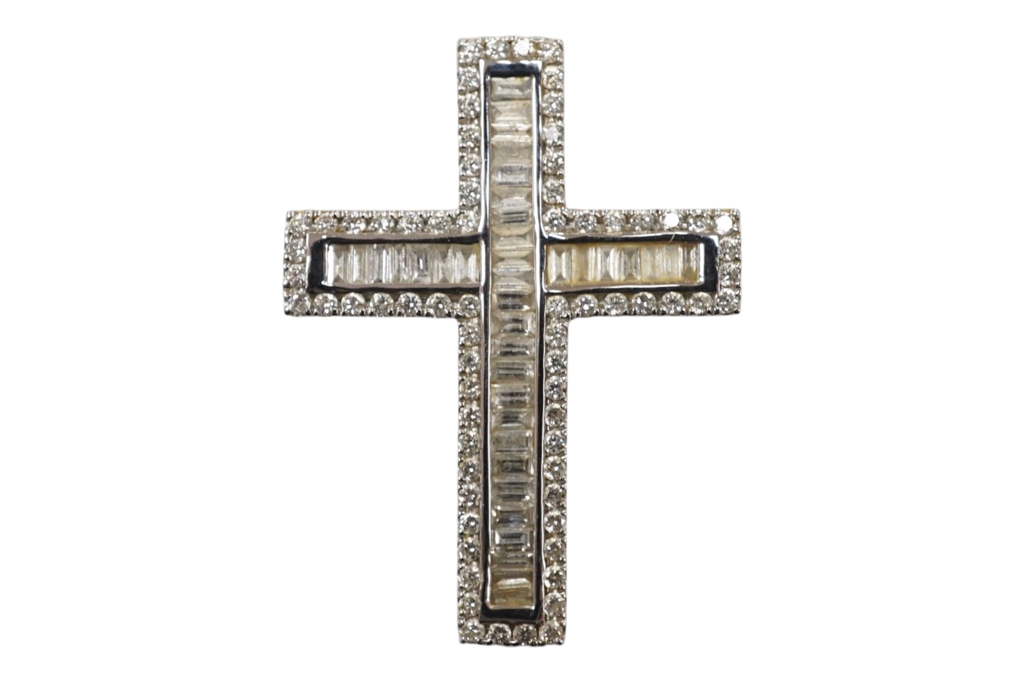 A recent white metal, baguette and round cut diamond cluster set cross ...