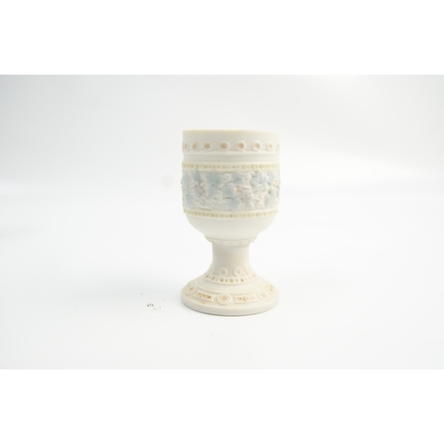 64 - A Collection of Ceramic and Porcelain Egg Cups including a Troika Double Egg CupA collection of ce... 