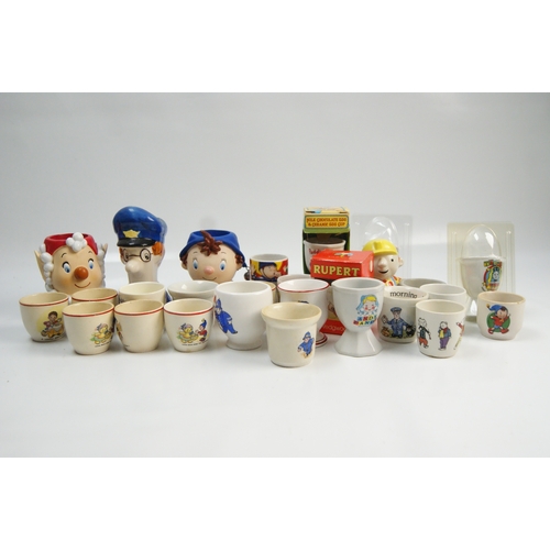 70 - A collection of vintage and contemporary character-themed ceramic egg cupsA collection of ceramic ... 