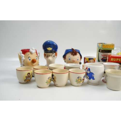 70 - A collection of vintage and contemporary character-themed ceramic egg cupsA collection of ceramic ... 