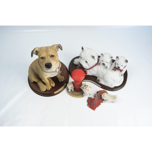 85 - A Collection of Leonardo Collection Painted Resin Dog FigurinesA collection of painted resin dog-t... 