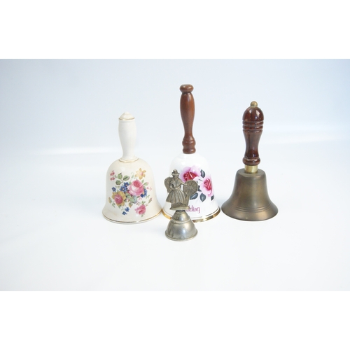 94 - A Collection of Ceramic, Brass, and Figural Hand BellsAn assortment of various hand bells of ceram... 