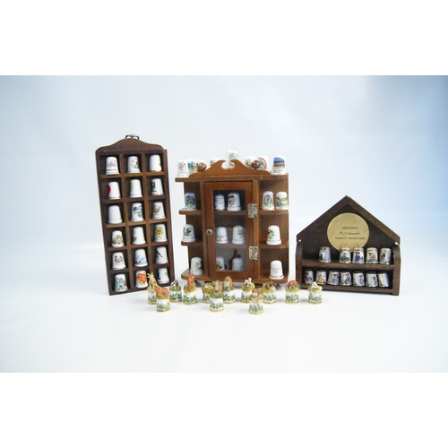96 - A Large Collection of Hummel and Franklin Mint Decorative Thimbles with Wooden Display StandsAn ex... 