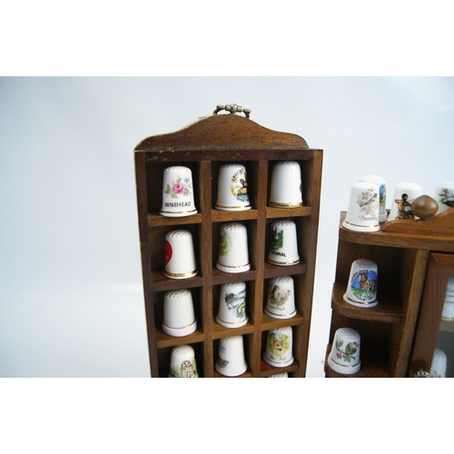 96 - A Large Collection of Hummel and Franklin Mint Decorative Thimbles with Wooden Display StandsAn ex... 